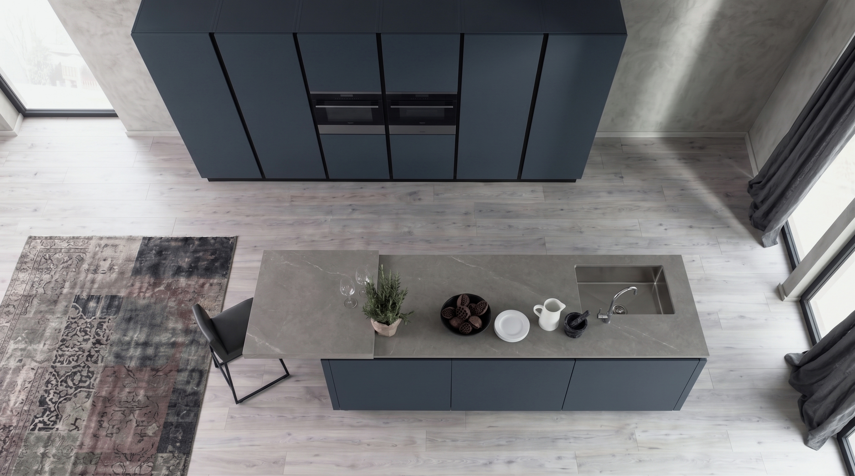 Gacaferi 1957 Indigo custom kitchen — seen from above, with a matte island and integrated sink